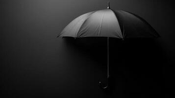 Black umbrella stands against a dark background, showcasing elegant simplicity and versatility in design and function photo