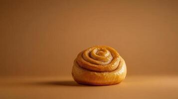 A small pastry with a rose shape on a brown background photo
