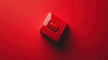 A red light switch on a red wall photo