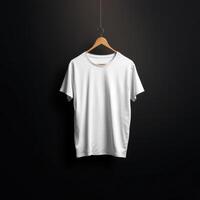 Solid White Tshirt Hanging on a Wooden Hanger Against a Black Background photo