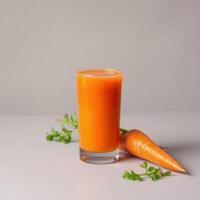 Fresh Carrot Juice in Glass with Carrot and Greens photo
