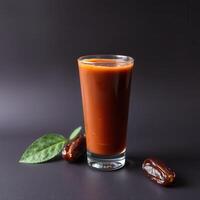 Refreshing Date Smoothie in Glass with Dates and Leaf photo