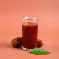 Refreshing Date Juice with Ripe Dates and a Leaf photo