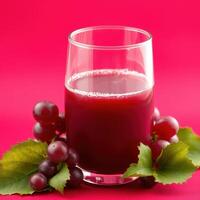 Refreshing Grape Juice in Glass with Grapes and Leaves photo