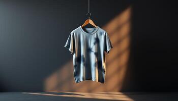 Blue Tie-Dye T-Shirt Hanging on Wooden Hanger in a Room with Soft Light photo