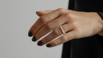 Elegant Silver Ring on a Woman's Hand. photo