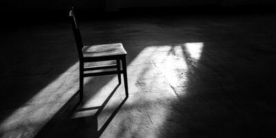 A Single Chair in a Ray of Light. photo