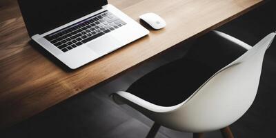 Minimalist Workspace Laptop. Mouse. Chair and Desk photo