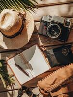 Travel Essentials on Wooden Background. photo