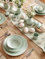 Easter Table Setting with Green and White Decor. photo