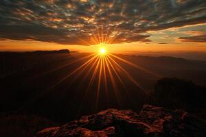 A beautiful sunset casting light over a mountain range, creating a picturesque atmosphere. photo