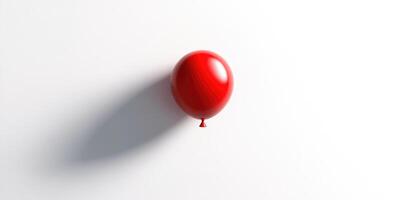 Vibrant red balloon floating against minimalist white background for celebrations and events photo