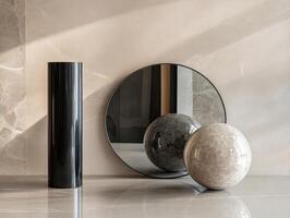 Modern geometric composition with cylindrical and spherical objects on reflective surface photo