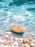 Serene scene of a toy boat floating in clear pool water with seashells photo
