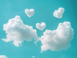 Dreamlike scene of heart shaped clouds in a clear blue sky photo