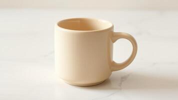 A beige ceramic coffee mug with a minimalist design on a white marble countertop. photo