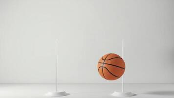 Minimalist photo of a basketball suspended in neutral gray space