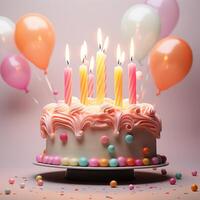 Colorful birthday cake with 7 candles on top and colorful photo