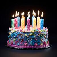 Birthday cake with colored candles on woode photo
