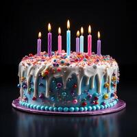 Birthday cake with colored candles on wooden table photo