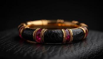 Elegant black and gold bracelet adorned with vibrant gemstones photo