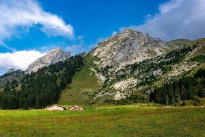 wooden house of the farmer in the mountains in La Cluzas photo