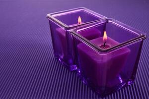 Purple Candle Glow. Two purple candles in glass holders photo
