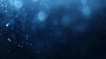Abstract blue bokeh background with sparkling particles and blurred lights. photo