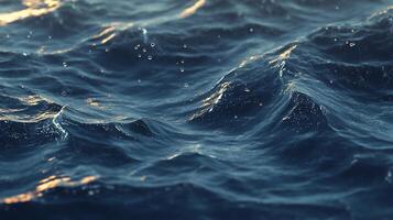 Close-up of dark blue ocean waves with sunlight reflecting on the surface, showing texture and movement. photo