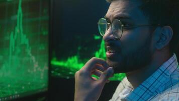 Displeased Indian Arabian man broker guy programming code cryptocurrency computer trading problem male angry programmer technology error coder crash failure chart cybersecurity Bitcoin web pc nervous video