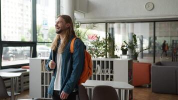 Male indoors office college academy university laugh having fun rejoice funny reaction Caucasian man guy businessman student business smiling laughing joy joyful humorous good mood studying education video