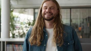 Portrait indoors in office college academy university library book store Caucasian man male guy businessman hipster student business looking at camera smiling laughing joy fun laugh joke funny glad video