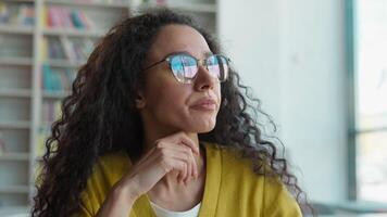 Tired Arabian Latino woman glasses rubbing eyes female exhausted overworked student girl feel pain eyestrain ache bad vision eyesight unhealthy study learning library high school university college video
