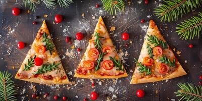 Christmas-themed pizza slices shaped like trees, topped with arugula, cherry tomatoes, and cheese, surrounded by festive decorations and pine branches photo