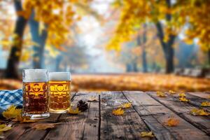 Two glasses of beer on a rustic wooden table surrounded by autumn leaves with a blurred forest background photo