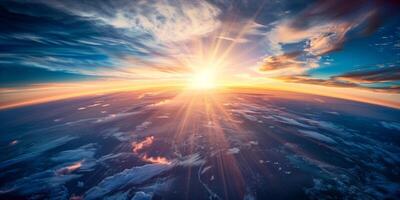 Vivid sunrise over Earths horizon with dramatic clouds and radiant sunbeams illuminating the atmosphere photo
