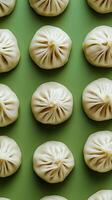 Aromatic Steamed Dumplings on a Green Background photo