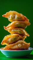 Crispy Fried Dumplings, Stacked High, Ready to Eat photo