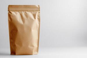 Brown paper doypack pouch packaging standing up against white background photo