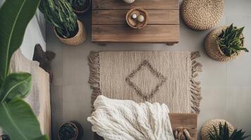 A rug, a wooden table and a plant on a floor photo