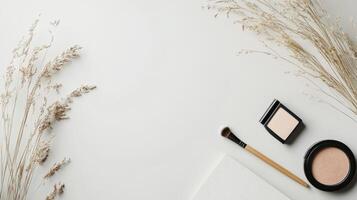 Makeup brushes and cosmetics on a white background photo