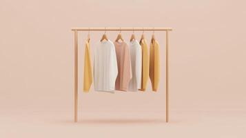 Clothes hanging on a wooden rack on a beige background photo
