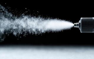 Disinfectant fogger releasing fine mist, showcasing effective sanitation. low angle shot highlights spray dispersal, emphasizing cleanliness and safety in various environments photo