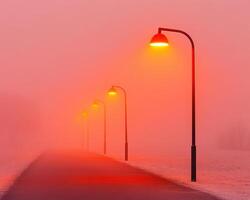 Streetlights glowing warmly through fog on quiet path, creating serene atmosphere. soft orange light contrasts beautifully with misty surroundings photo