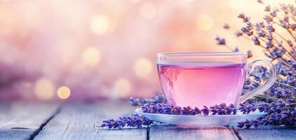 Elegant lavender tea in frosted glass cup surrounded by lavender flowers, creating serene and calming atmosphere. Perfect for relaxation and enjoyment photo