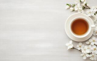 cup of aromatic tea surrounded by delicate white flowers creates serene atmosphere, perfect for relaxation and enjoyment photo