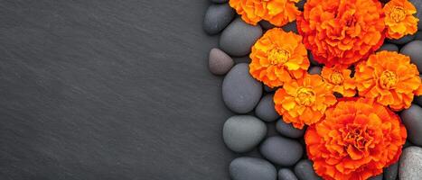 Luxurious spa ambiance with marigold flowers and smooth pebbles, creating serene and calming atmosphere. Perfect for relaxation and wellness photo