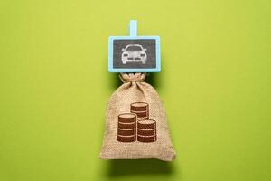 Save up to buy a car. Part of personal budget a car maintenance. Financial planning. Take a loan. photo