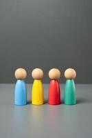 Multi-colored people figures. People representing different groups, communities and cultures. Consumer groups, their preferences and purchasing power. Marketing and segmentation. photo