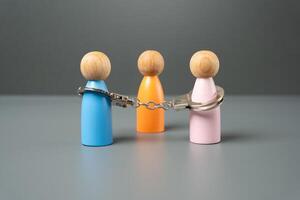 The couple are handcuffed by obligations. Marriage concept. Establish the obligations of the parties through a verdict. Problems in relationships. Difficulty reaching an agreement in divorce. photo